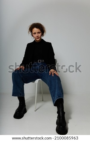 beautiful woman black jacket jeans posing Lifestyle unaltered