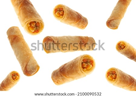 Vegetable spring rolls flying on isolated white background full and cut. Royalty-Free Stock Photo #2100090532