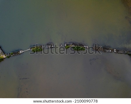 Aerial view of an old broken bridge found near La Case du Pecheur lodges which are located on the south-east coast of Mauritius island at Bambous Virieux