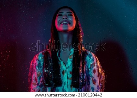 Photo of lovely lady look up wear rubber coat enjoy rainfall storm isolated multicolor vivid color background