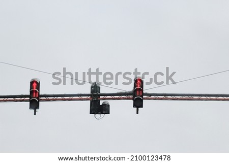 red traffic light on the sky background