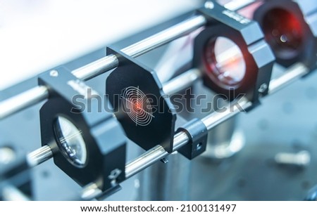Experiment with laser device in optical laboratory Royalty-Free Stock Photo #2100131497