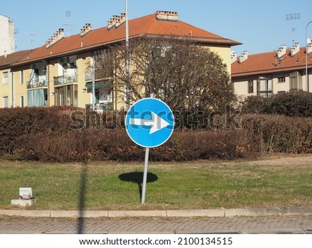 direction arrow traffic sign in a roundabout