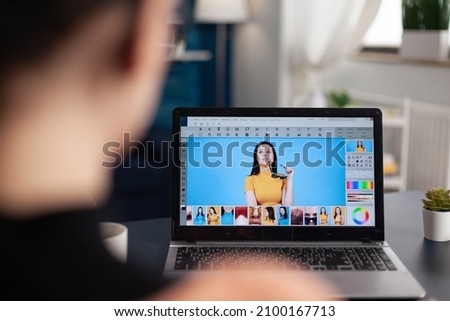 Freelancer photo editor working from home office. Student retouching photos on laptop using editing software. Creative artist working remote creating digital art with digital tools.