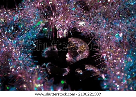 shattered christmas ornaments surrounded by pretty lights