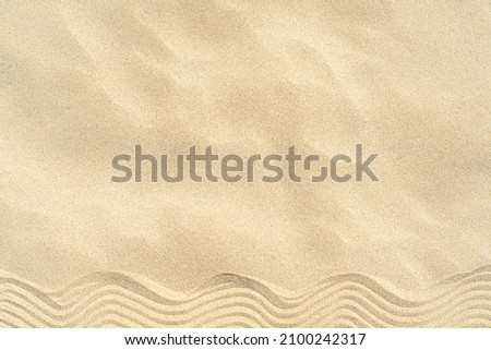 Drawing of waves on the sand on the beach, sand pattern