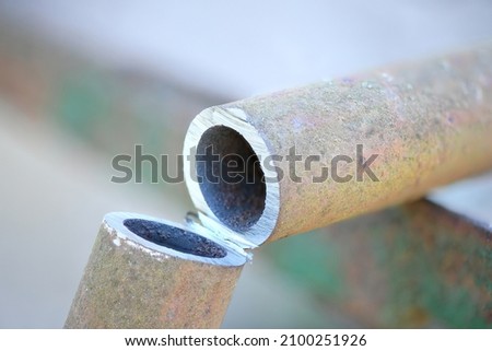 Metal pipe cutting. Cut metal pipe with a grinder. High resolution photo. 