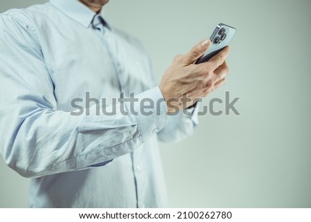 close up of white man using mobile device
