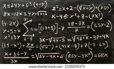Mathematical operations written by hand with a chalk on the blackboard Royalty-Free Stock Photo #2100299371