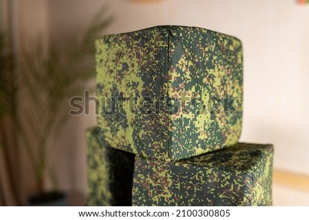 Camouflage foam cubes. Close-up. Children's games. Attributes for children's games