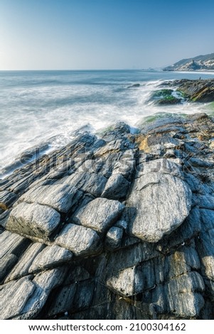 waves and rocks in long exposure