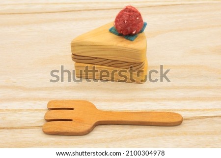 Cute wooden kitchen miscellaneous goods placed on a cutting board Royalty-Free Stock Photo #2100304978
