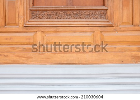 Old style  brown wooden wall with carving, property of one Thai temple