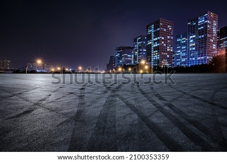 Panoramic skyline and modern commercial buildings with empty asphalt road Royalty-Free Stock Photo #2100353359