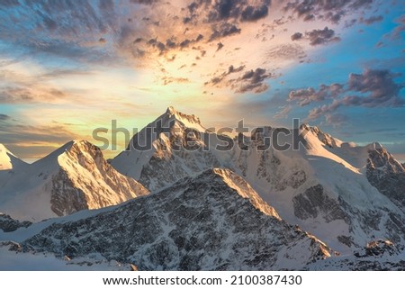 High mountain winter landscape in the Swiss Alps with computer modified sky