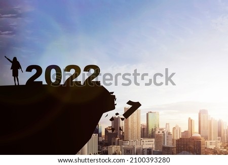 Silhouette of businesswoman celebrating the new year. Happy New Year 2022