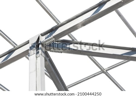 Detail of a new precast steel structure with pillars, steel beams and bolts in galvanized steel against a black background Royalty-Free Stock Photo #2100444250