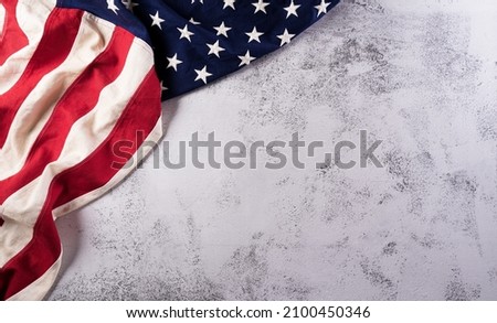 Happy presidents day concept with flag of the United States on stone background.