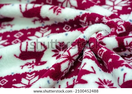 Velvet. Plush. For winter wear. Snow deer, snowflakes. Red and white tones. Silk fabric with soft, smooth and thick pile. Rich Silk Cloth
