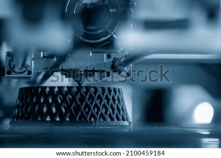 The 3D printer machine  print out the prototype model parts. The hi technology 3D model process by rapid prototype 3D printer. Royalty-Free Stock Photo #2100459184