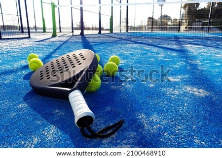 happy pretty girl practicing paddle sport on the paddle court Royalty-Free Stock Photo #2100468910