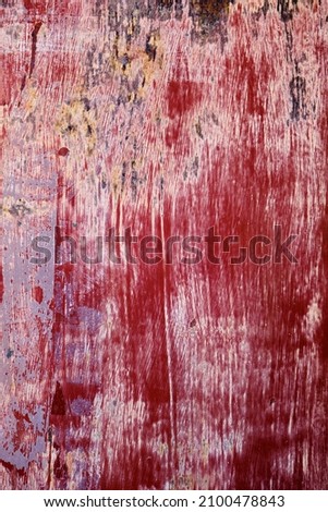 Worn out red painted corroded metal grunge texture