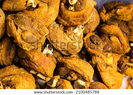 Picture of freshly cooked Thai food called Crispy Pata or Crispy Pork Knuckle. Delicious and healthful