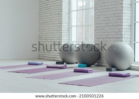 Yoga mats and balls. Yoga accessories, hall, room. High quality photo Royalty-Free Stock Photo #2100501226