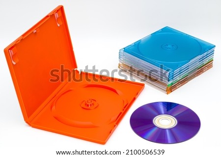 DVD disk and lot of plastic multicolored cases