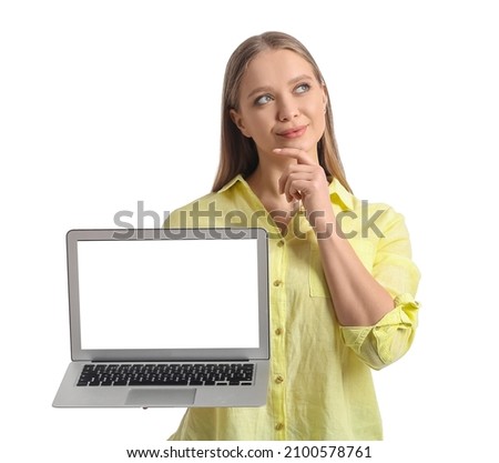 Thoughtful young woman holding laptop with blank screen on white background