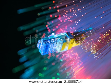 network cables closeup with fiber optical background Royalty-Free Stock Photo #210058714