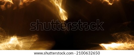 Easy to add lens flare effects for overlay designs or screen blending mode to make high-quality images. Abstract sun burst, iridescent glare over black background. Wide angle horizontal wallpaper.