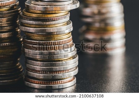 coins stacked on each other in different positions, Growth money of profitability of professional investment planning, Business, and finance concept.