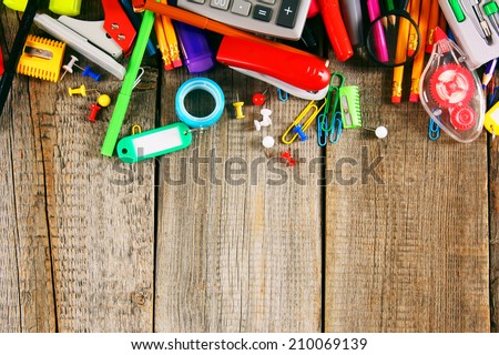 School tools. On a wooden background.