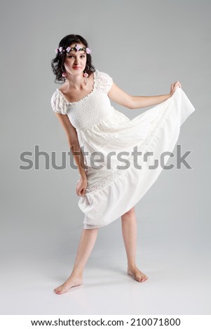 fashion woman Young woman in white with wreath of flowers