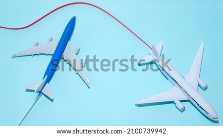 Airplane in flight with a contrail copy space. Travel concept by avalanias. Baner model airplanes