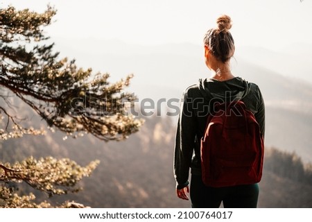  Young traveler hiking  with backpacks. Hiking in mountains. Sunny landscape. Tourist traveler on background view mockup. High tatras , slovakia