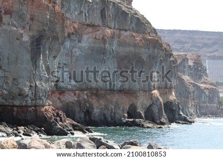 Several caves on a cliff in Puerto de Mogan, Gran Canaria Spain.

