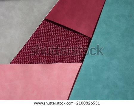 red, burgundy, blue, gray geometric shapes as background, knitting middle