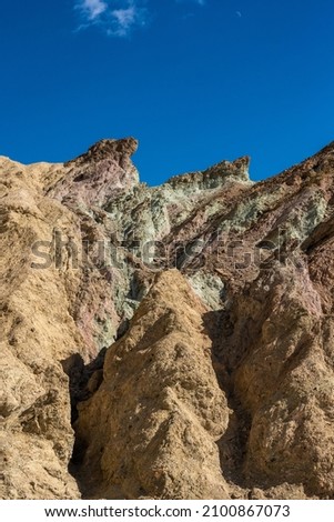 Multicolored Mountain Side Under a Blue Sky In Death Valley National park
