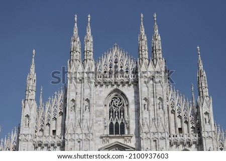 The famous Cathedral of Duovo on blue sky background in Milan Italy