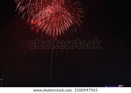 Red firework pictured for use in various celebrations.