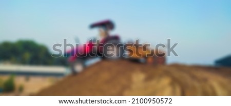 Blur Matte painting of indian farmer working on tractor in farm for vfx and movie production