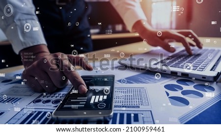 Businessman accountant or financial expert analyze business report graph and finance chart at corporate office. conceptual of finance economy, banking business and stock market research. Royalty-Free Stock Photo #2100959461