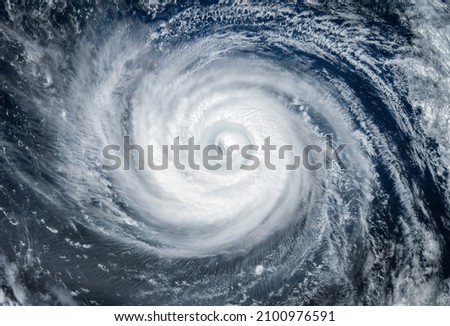 Super Typhoon, tropical storm, cyclone, hurricane, tornado, over ocean. Weather background. Typhoon,  storm, windstorm, superstorm, gale moves to the ground.  Elements of this image furnished by NASA. Royalty-Free Stock Photo #2100976591