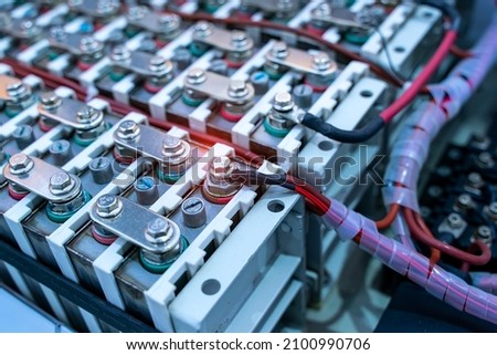Electric car lithium battery pack and wiring connections internal between cells on background. Royalty-Free Stock Photo #2100990706