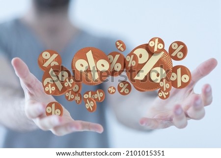 A closeup of the hands holding the floating percentage signs 