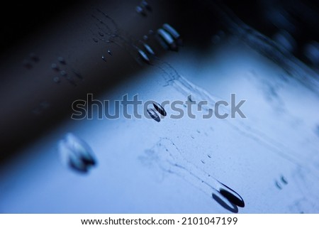 Water droplets in window reflection