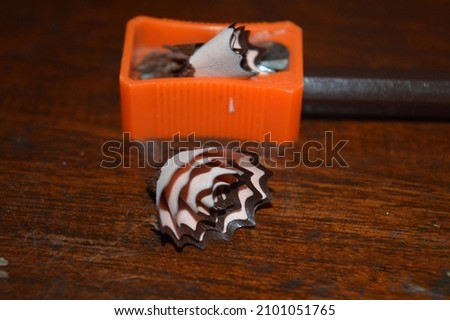 pencil, sharpener and shavings on the table