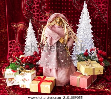 The Befana with yellow straw hair on Christmas background. Traditional witch costume for Italian Epiphany day.